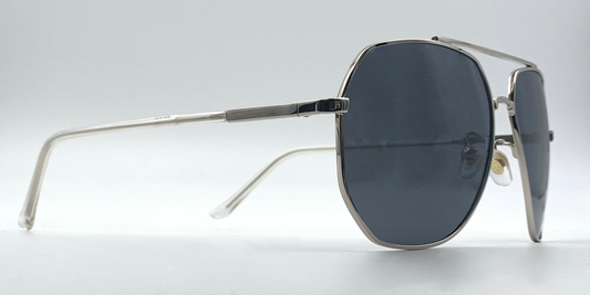 Aviator style glasses. Silver colour rims, bridge and arms. side view with blue tinted lenses.