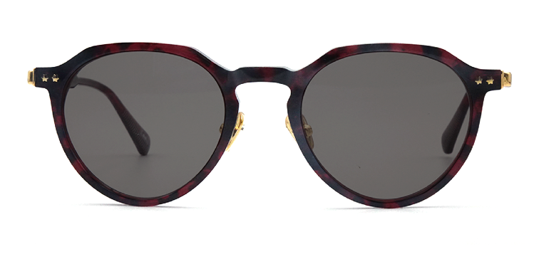 red an black coloured round retro style frame front view showing two gold coloured stars by the arms with tinted lenses