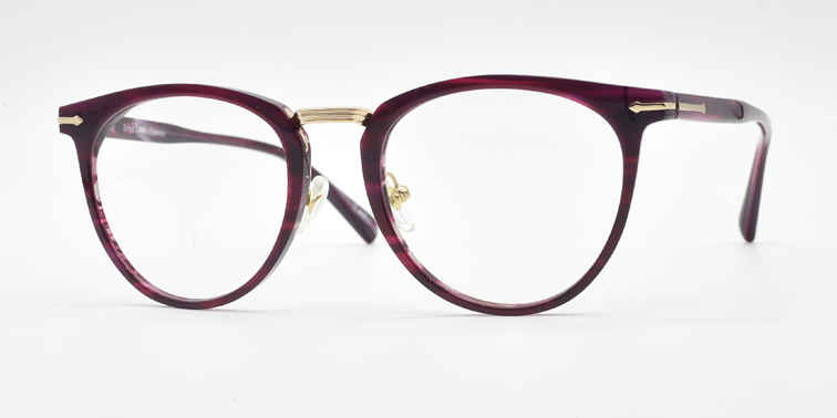 round retro style frame. side view showing gold coloured bridge and gold detail on hinges