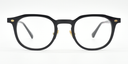 black round frame with gold highlights towards the hinges. front view