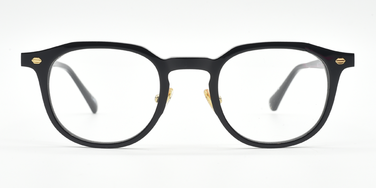 black round frame with gold highlights towards the hinges. front view