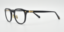black round frame with gold highlights towards the hinges. side view showing gold highlights near to hinges