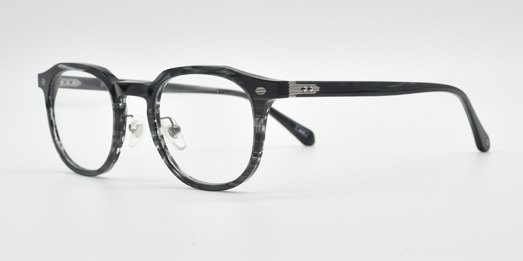 grey marble effect round frame with silver highlights towards the hinges. side view showing silver detail on arm close to the hinge