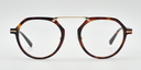 tortoiseshell frame with gold colour bridge. front view octagonal frame with round lenses.
