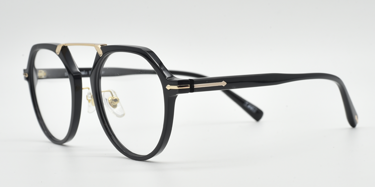 black frame with gold colour bridge. side view octagonal frame with round lenses. gold details on arm close to the hinge