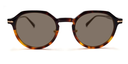 Front view octagonal tortoiseshell frame with rounded tinted lenses and small gold detail close to hinges