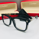 Cartier eyeglasses with red and gold case in the background