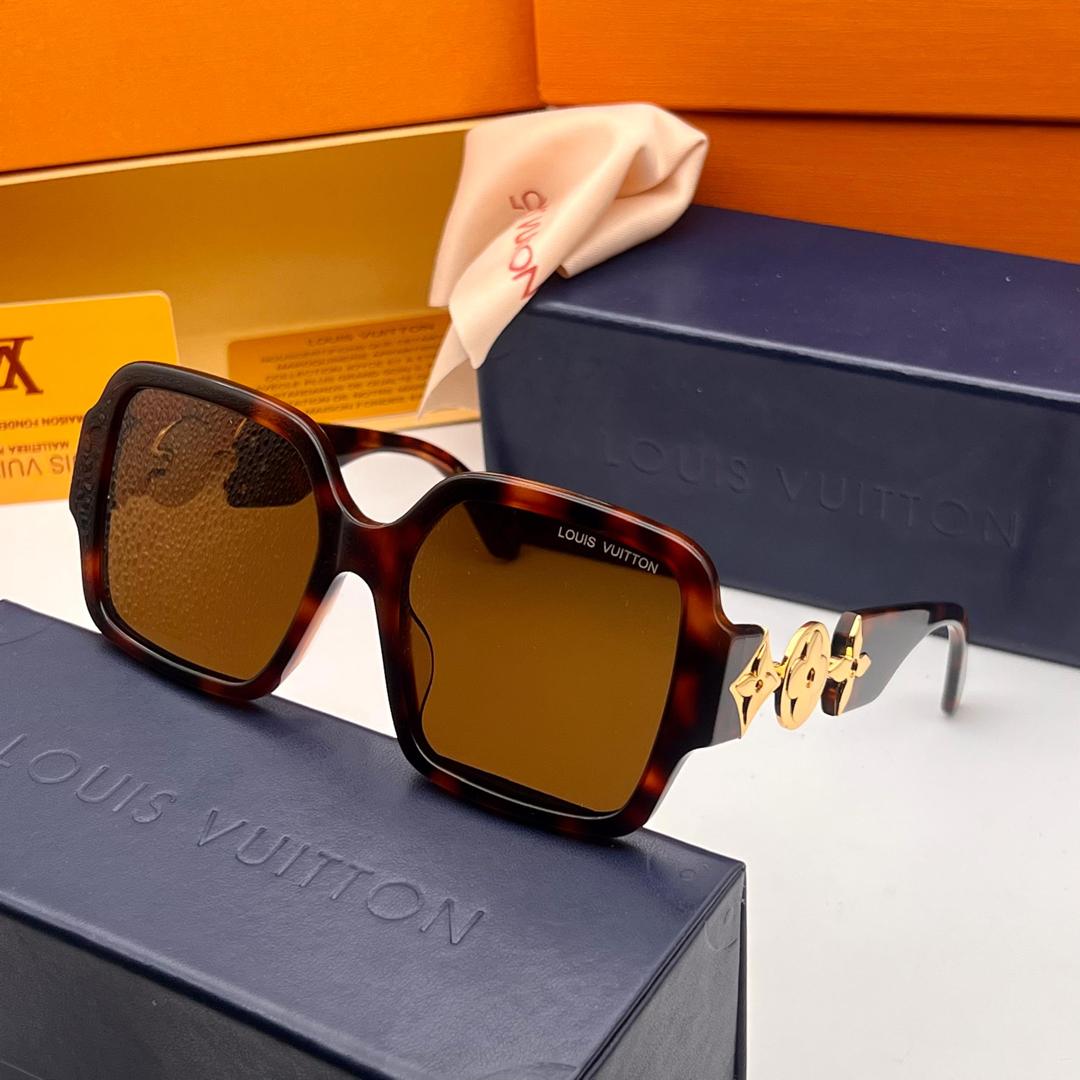 Louis Vuitton sunglasses with tortoiseshell frame and brown lenses on a Louis Vuitton box.
