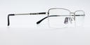 silver coloured rectangular titanium half frame. side view showing silver coloured bridge and arm