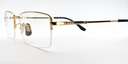 gold coloured rectangular titanium half frame. side view showing gold coloured bridge and arm