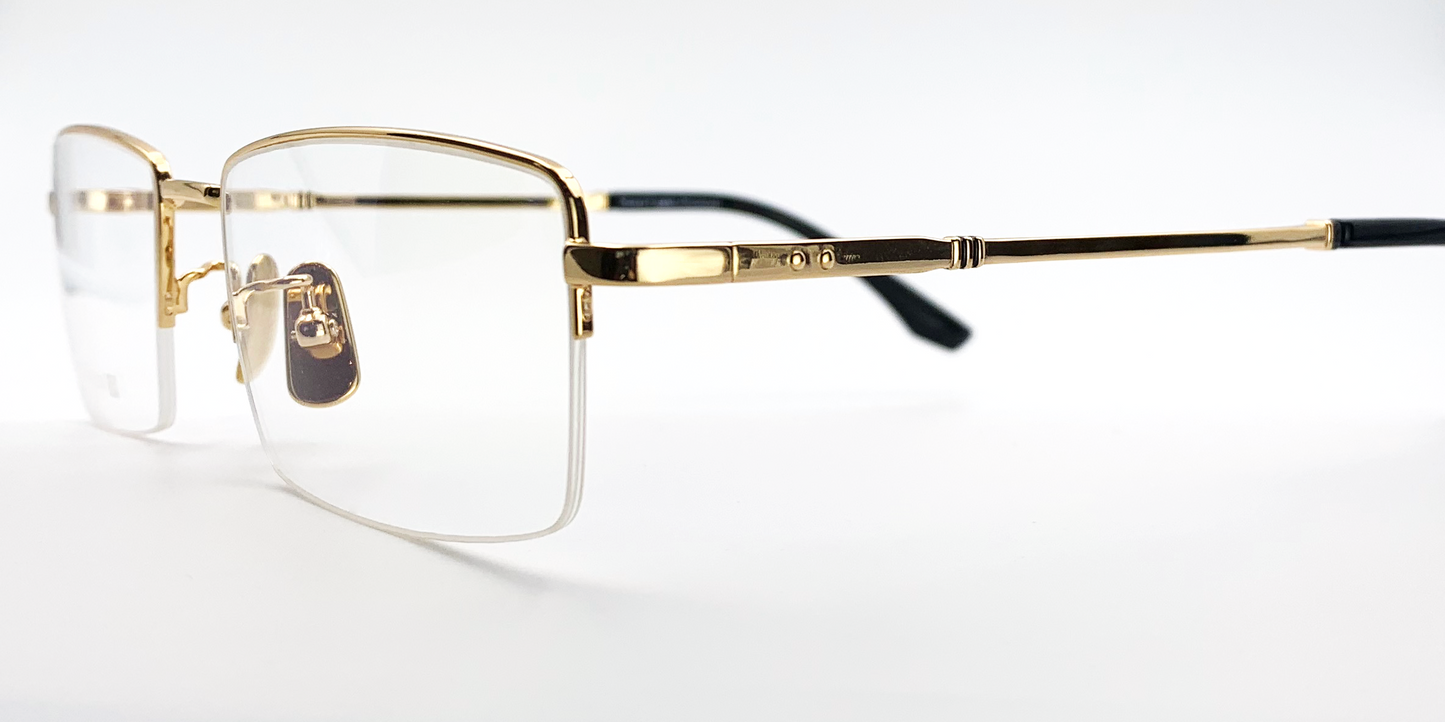 gold coloured rectangular titanium half frame. side view showing gold coloured bridge and arm