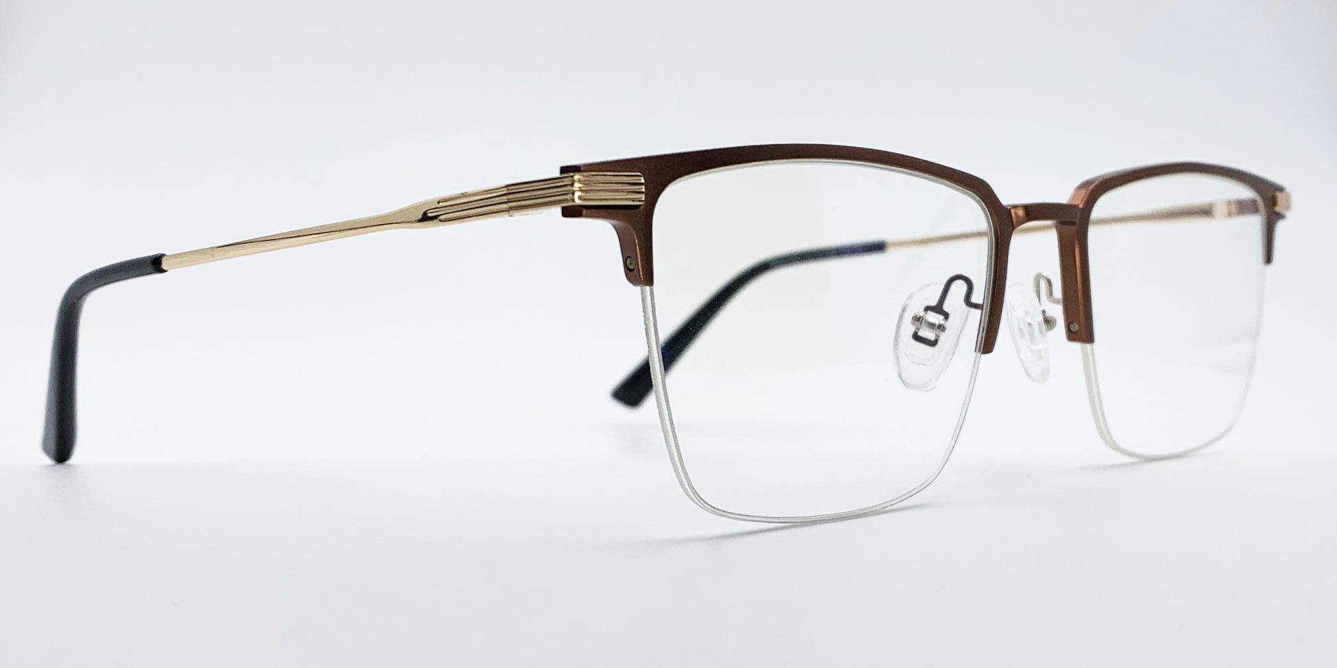 brown rectangular half rimless frame glasses. Side view with gold detail