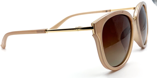 side view. Stylish semi-cat eye glasses  in light brown with tinted glasses. gold coloured features