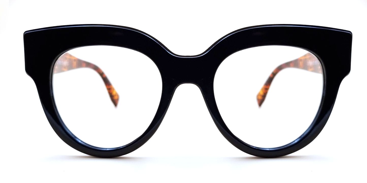 Large moulded, all-in-one, black frame glasses housing round lens. Front view 