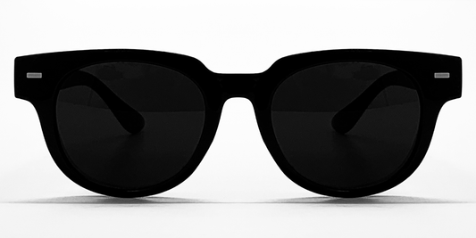 black curved square frame glasses with very dark lenses, Front view showing small silver colour detail close to the hinges. All-in-one acetate frame.