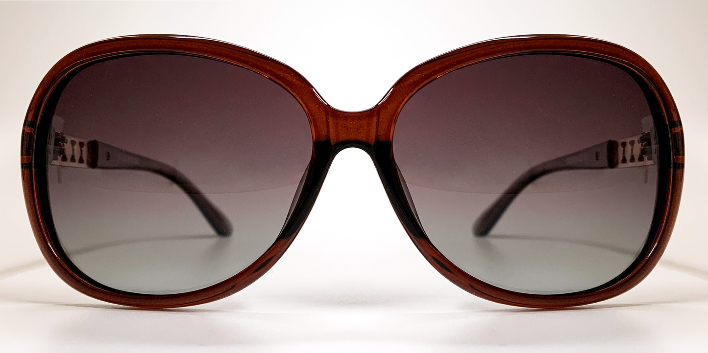 Front view, large rounded rectangular black frame with tinted lenses
