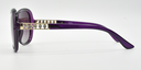 side view, large rounded rectangular purple frame with tinted lenses. gold with 5 small gemstones detail on top part of the arm.