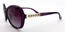 side view, large rounded rectangular purple frame with tinted lenses. gold with 5 small gemstones detail on top part of the arm.
