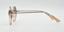Side view, round frame with tinted lenses. Showing gold embellishments around the frame in more detail.