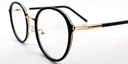 side view of round retro-style black frame with gold coloured bridge and gold embellishments around the frame and top of the arms