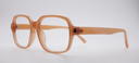 side view of light brown rounded rectangular frame. all one colour including arms
