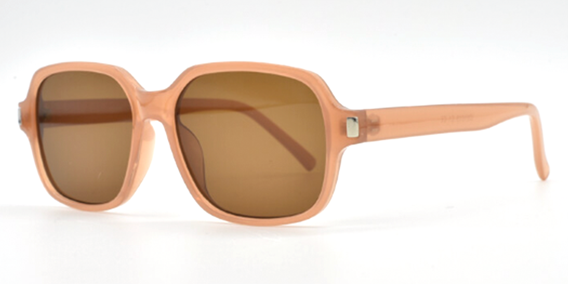 side view of light brown rounded rectangular frame. all one colour including arms. showing tinted lenses