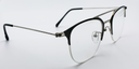 Side view round half rimless glasses. Black with silver coloured bridge hinges and arms. 