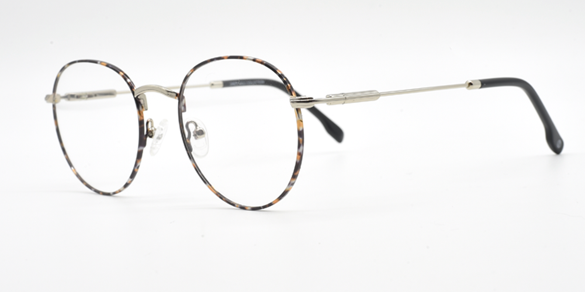 side view delicate round metal frame. tortoiseshell  colour, silver colour bridge and arms