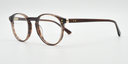 Side view round retro style glasses in brown marbled colour