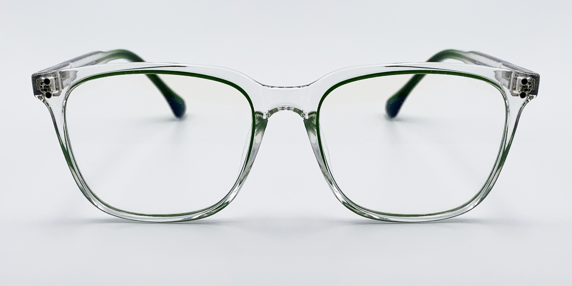 Clear with a hint of green. Front facing rounded rectangular lenses.