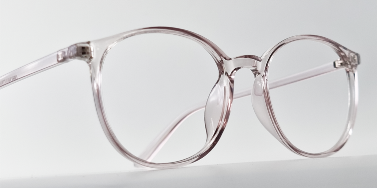 Side view of clear round retro-style glasses. frame and arms same colour.