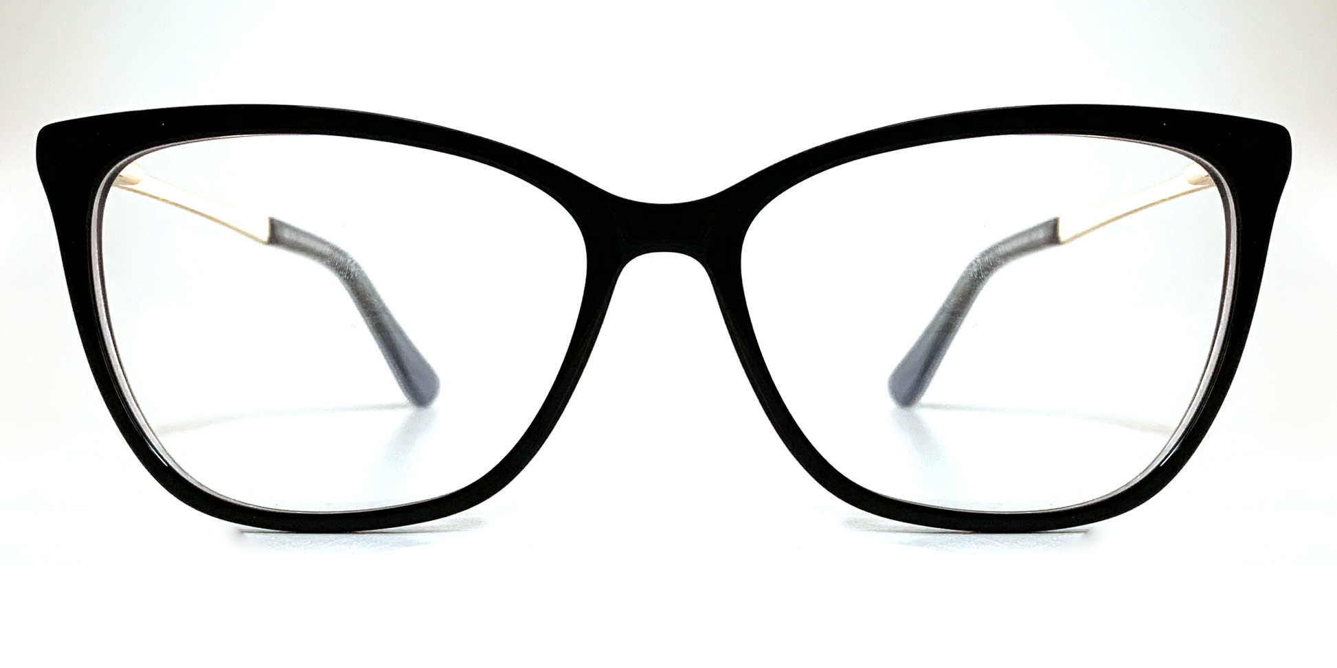 Front view. Black cat's-eye frame glasses. Gold coloured inner and black coloured outer arms.