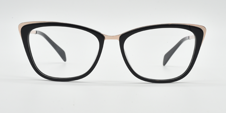 Front view. black cat's-eye frame showing gold coloured highlights to the top corners of the frame. 