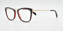 Front/side view. black/red cat's-eye frame showing gold coloured highlights to the top corners of the frame. Gold coloured arms.