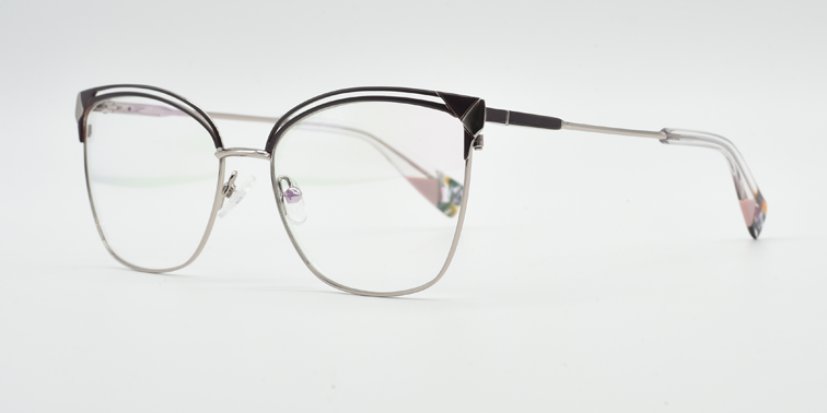 Front/side view of black/silver frame. black filigree detail on top of the frame. silver coloured bridge, arms and lower part of the frame.