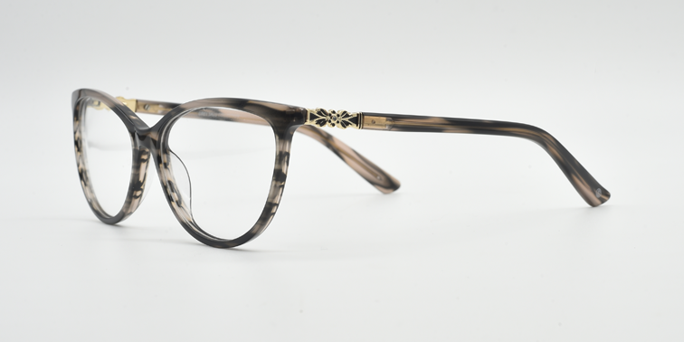 Front/side view. Cat's eye glasses in grey marble colour. attractive  flower detail at top of the arm