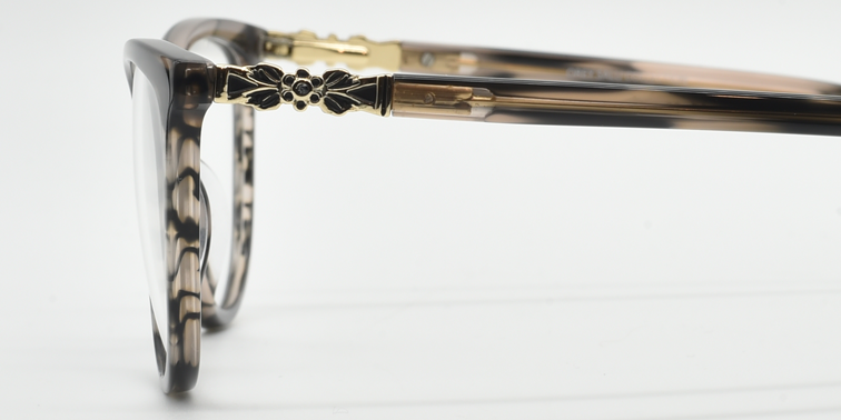 side view. Showing Gold flower detail at top of the arm