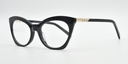 Front/side facing black cat's eye frame showing zig-zag crystal detail on the arm