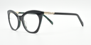 Front/side facing green cat's eye frame showing zig-zag crystal detail on the arm