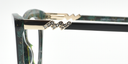 side view green cat's eye frame showing zig-zag crystal detail on the arm