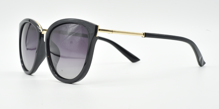 side view. Stylish semi-cat eye glasses  in black with tinted glasses. gold coloured features