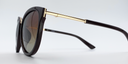 side view. Stylish semi-cat eye glasses  in dark brown with tinted glasses. gold coloured features