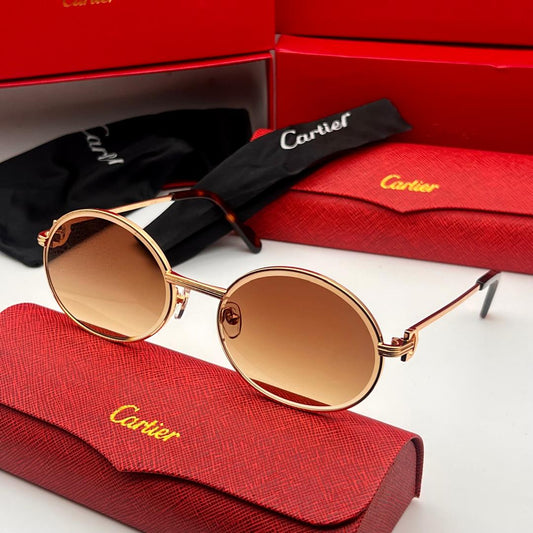Cartier sunglasses with red case and box on a white background