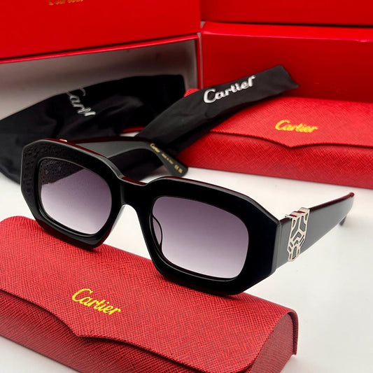 Black Cartier sunglasses on a red case with a red box in the background