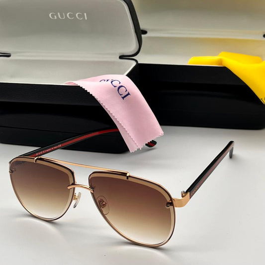 gold coloured rectangular frame, showing black and red arm. Viewed with black glasses case and cloth