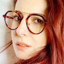 young woman wearing tortoiseshell octagonal with round lense frame