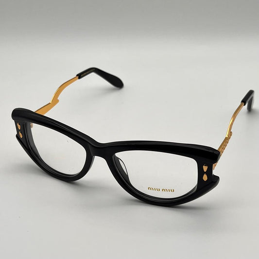 Black and gold Miu Miu eyeglasses on a light gray background