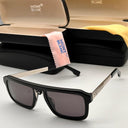 Black glasses with a Mont Blanc case and cloth on a light grey background