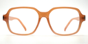 front view of light brown rounded rectangular frame. all one colour including arms. 