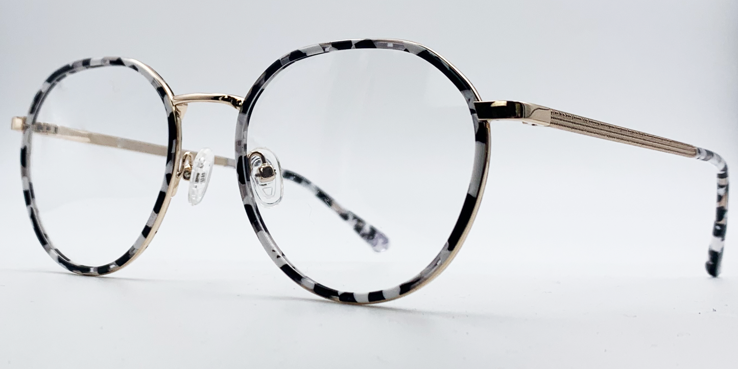 black and white round retro-style frame. Side view showing gold coloured bridge and arm